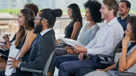 a group of seated attendees at a live event